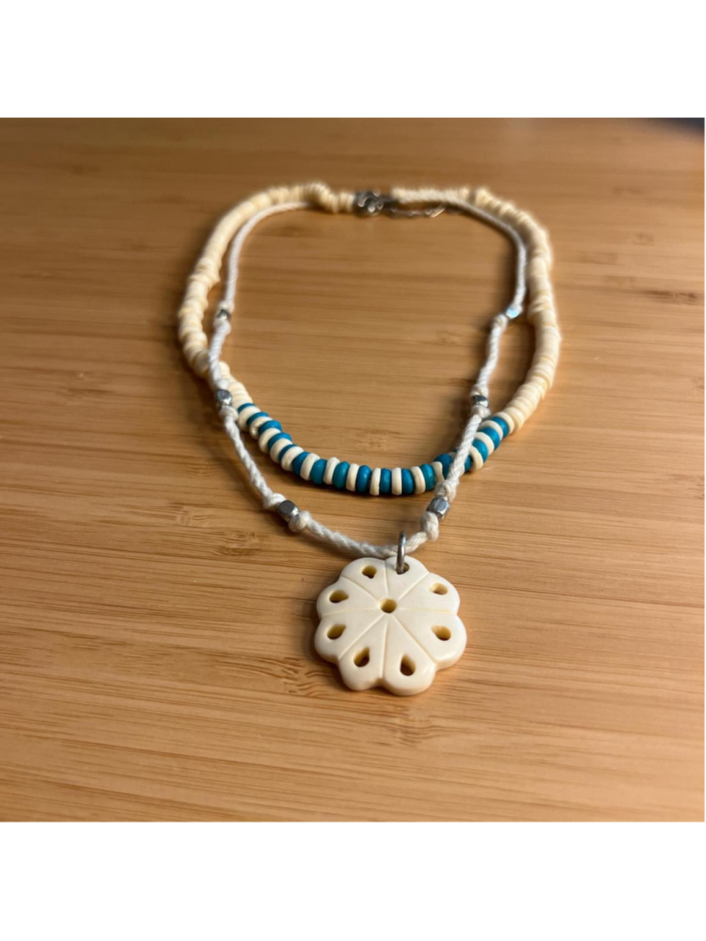 Teal and cream shell/beaded double-layered necklace with flower pendant